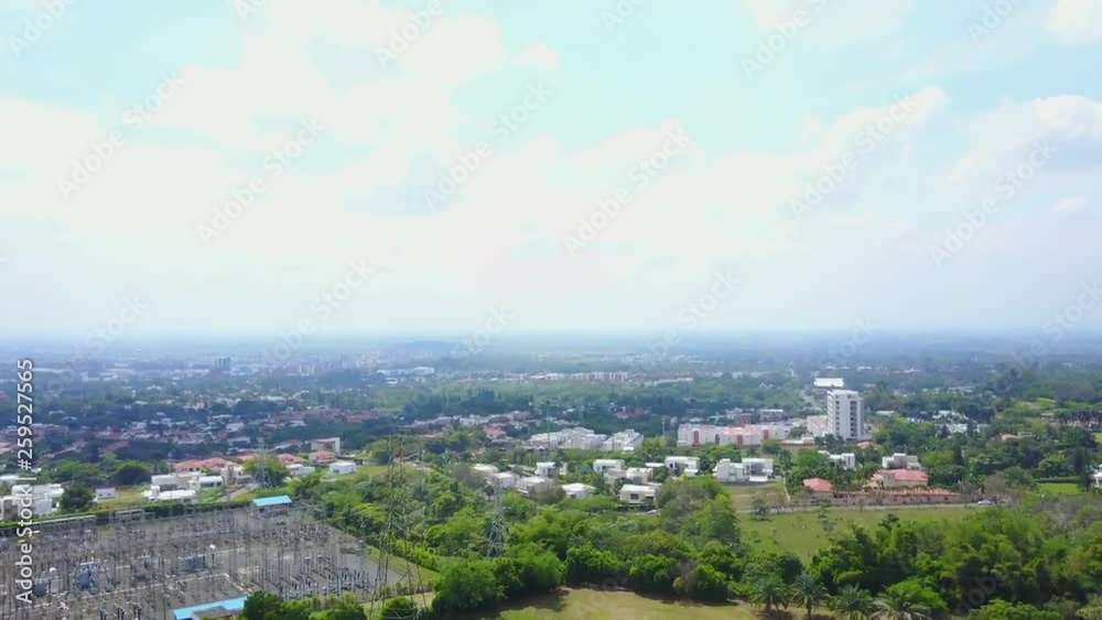 AERIAL: wide pull back over the suburban area of Cali, Colombia. AERIAL: wide pull back over the suburban area of Cali, Colombia.
