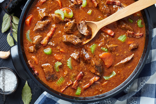 irish beef and beer stew in a pot photo
