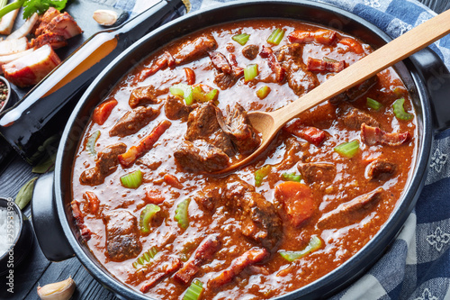 irish beef and beer stew in a pot photo