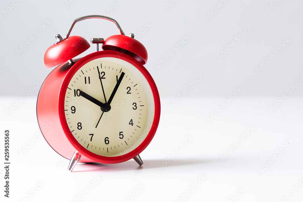 the alarm clock laying on the table and empty copy space the alarm clock laying on the table and empty copy space