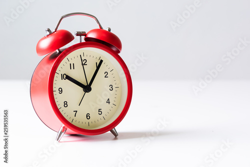 the alarm clock laying on the table and empty copy space