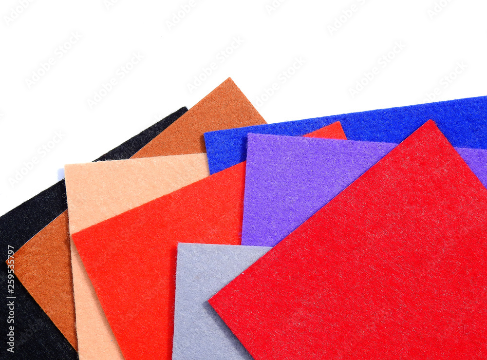 pile of colorful frieze fabric cloth on white background