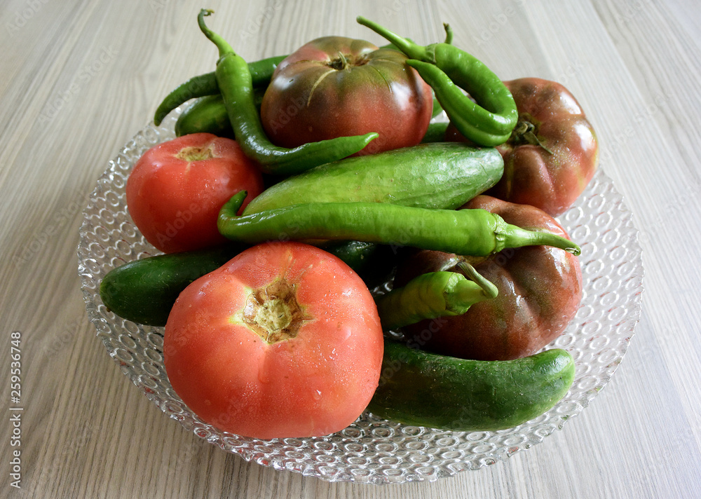 Fresh organic vegetables in glass bowl Fresh organic vegetables in glass bowl