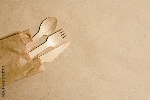 Disposable tableware from natural materials, wooden spoon, fork, knife, eco-friendly. Place for text