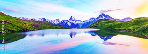 Obraz na płótnie Fantastic landscape at sunrise over the lake in the Swiss Alps. w salonie