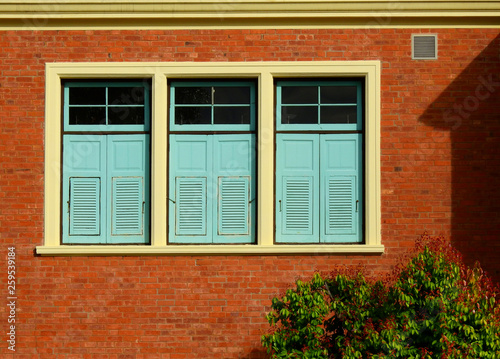 wood window on brick wall