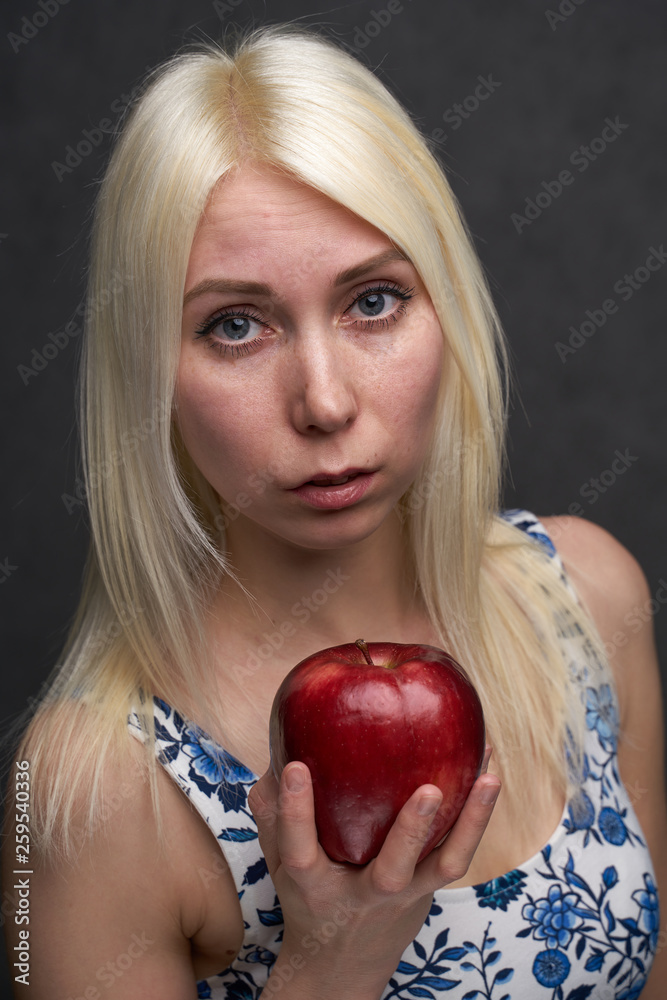 beautiful girl in a fashionable dress with apple beautiful girl in a fashionable dress with apple