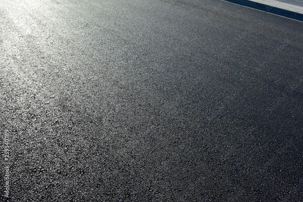 Fototapeta premium Asphalt road with sidewalk