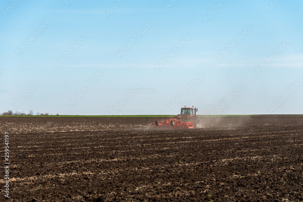 Tractor plowing fields. Tractor plowing fields.