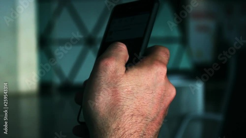 Closeup of a hand scrolling on a phone photo