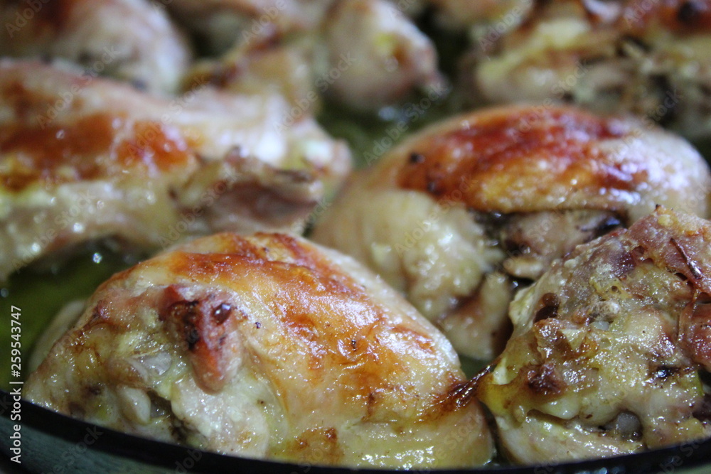 fried pieces of chicken,juicy meat in the home kitchen fried pieces of chicken,juicy meat in the home kitchen
