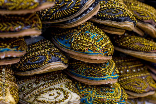 Middle eastern handmade shoes at the market display in Dubai. Gold souk