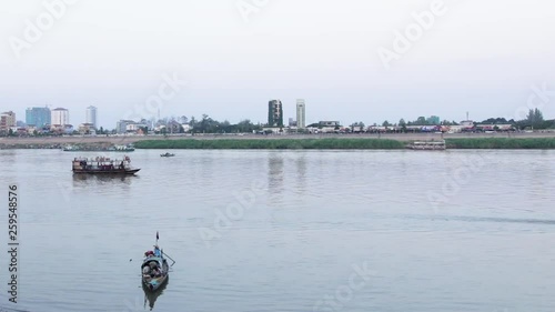 Timelapse (close up) of boat and ferry crusing at Mekong river, Phnom Penh Cambodia photo