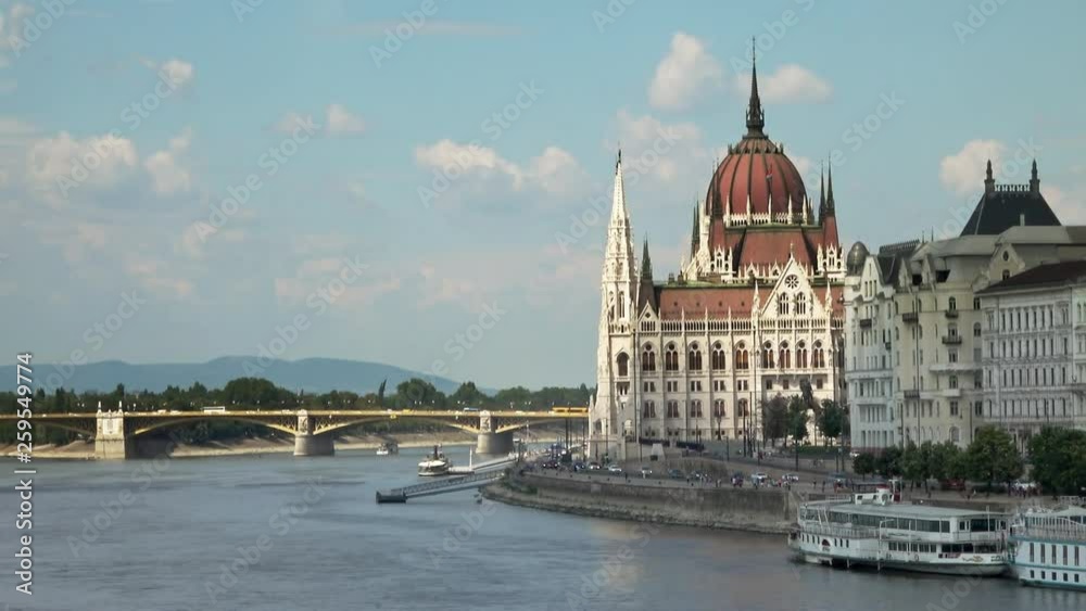 Beautiful view of The Hungarian Parliament Building and The Margaret Bridge, Budapest, Hungary on a sunny day. Beautiful view of The Hungarian Parliament Building and The Margaret Bridge, Budapest, Hungary on a sunny day.