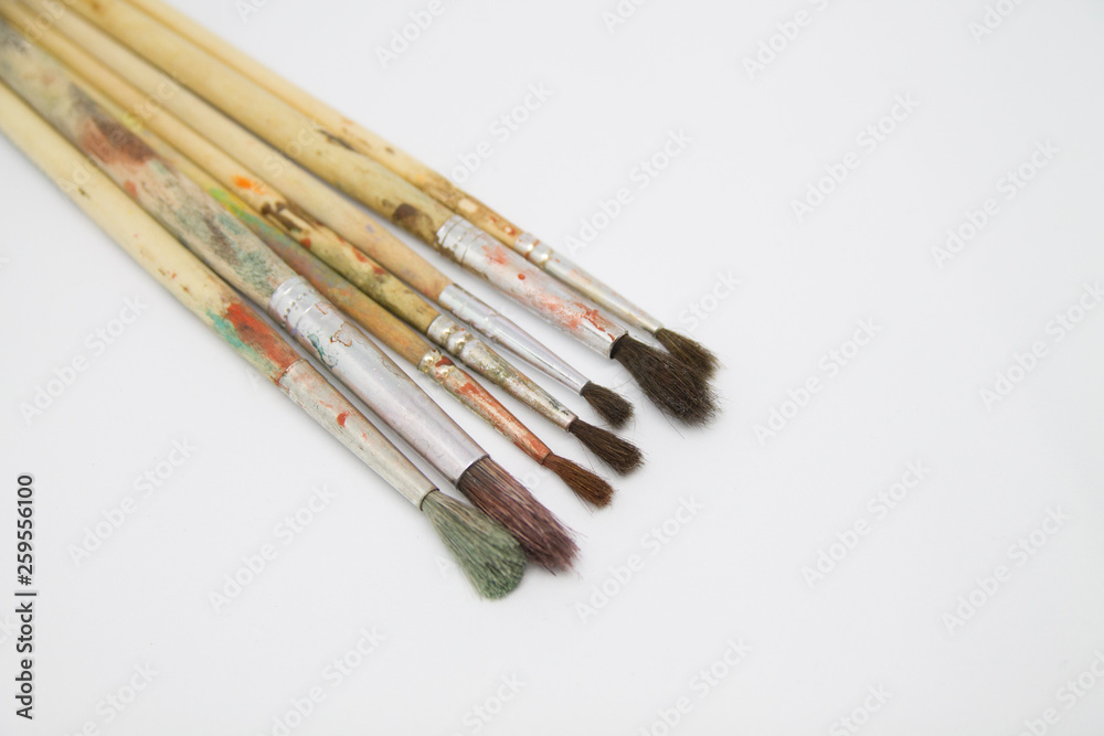 Paint brushes and paints for drawing isolated on white background