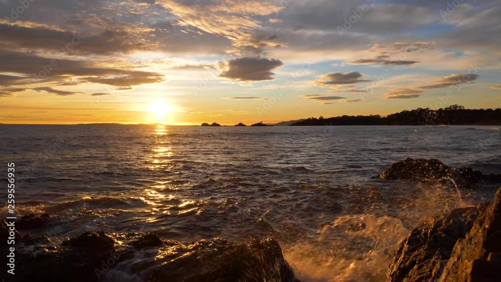 Rocky coastline and waves, sunset light by the Mediterranean sea Rocky coastline and waves, sunset light by the Mediterranean sea