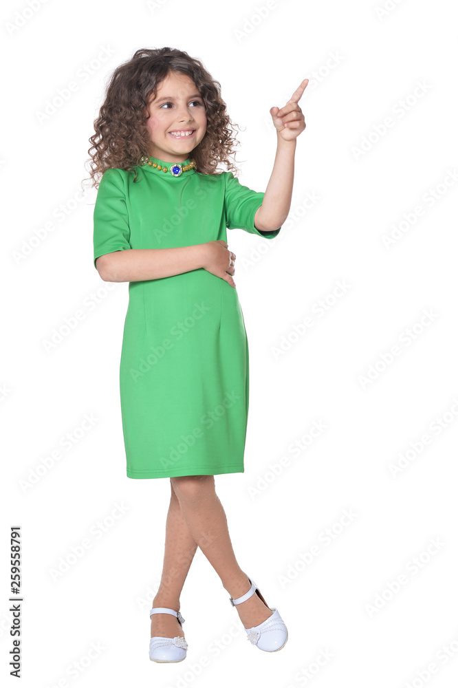 Portrait of cute little girl posing in green dress on white background Portrait of cute little girl posing in green dress on white background