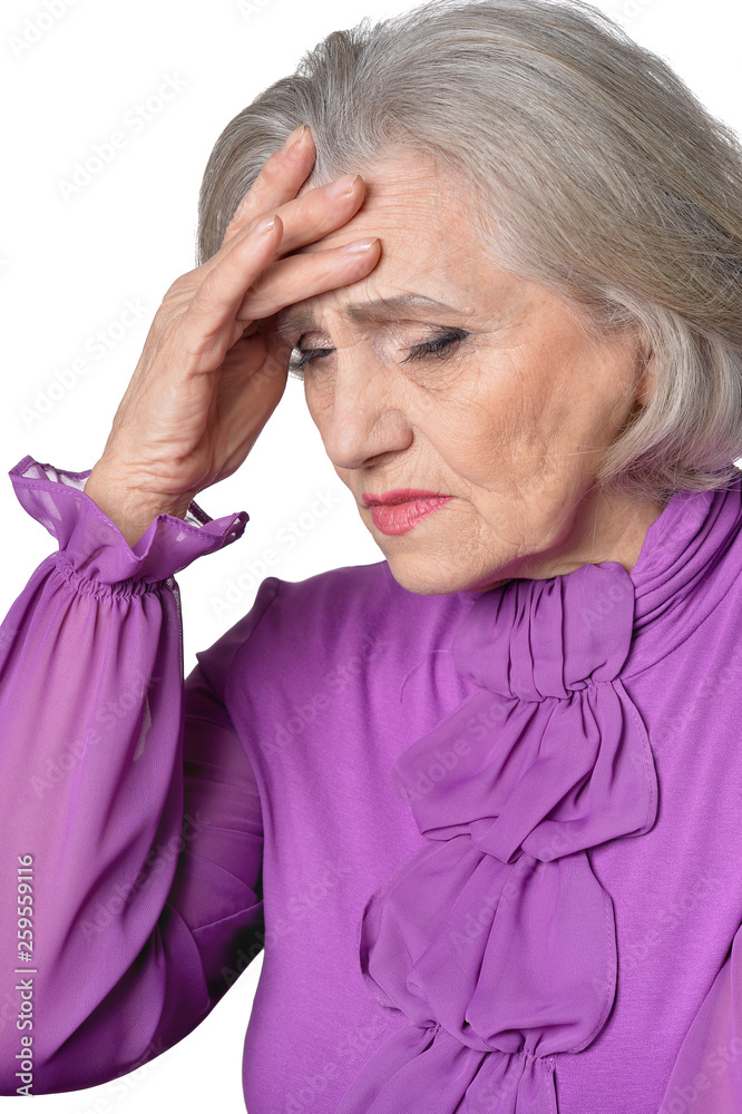 Portrait of thoughtful senior woman with headache on white background Portrait of thoughtful senior woman with headache on white background