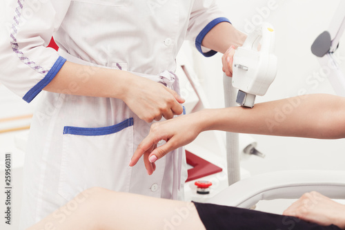 Skin care concept. Young woman getting peeling tretment at cosmetic beauty spa clinic. Indoor shot