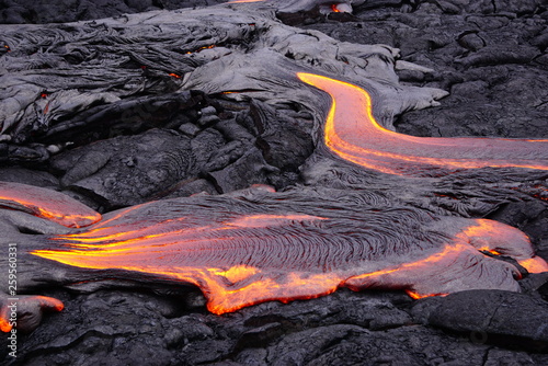 Lava field with new hot flowing lava in Big Island in Hawaii photo