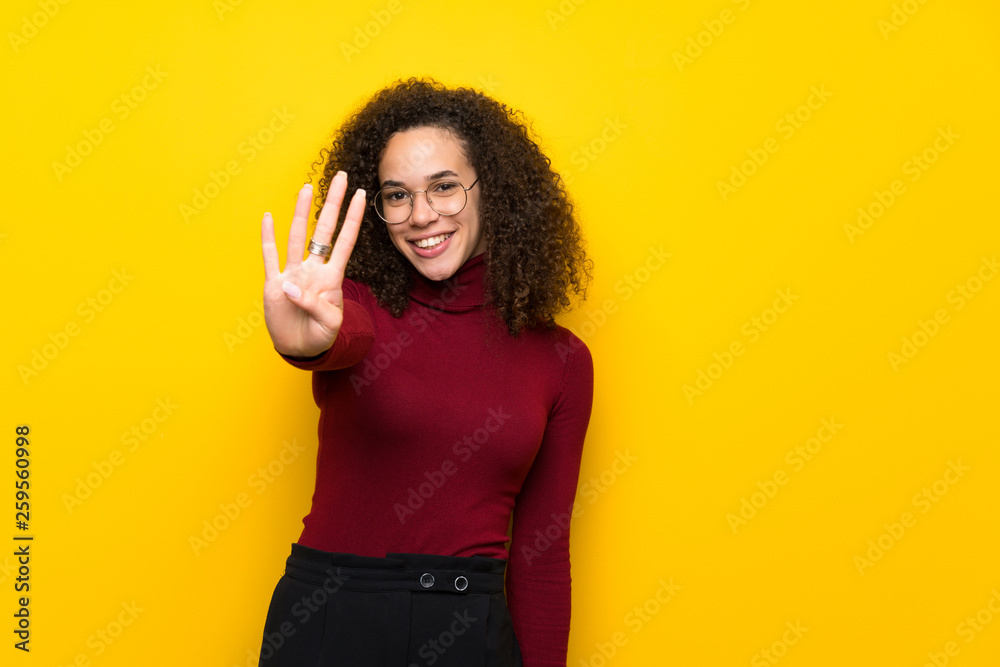 Dominican woman with turtleneck sweater happy and counting four with fingers Dominican woman with turtleneck sweater happy and counting four with fingers