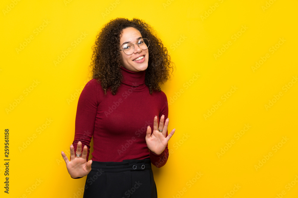Dominican woman with turtleneck sweater smiling Dominican woman with turtleneck sweater smiling