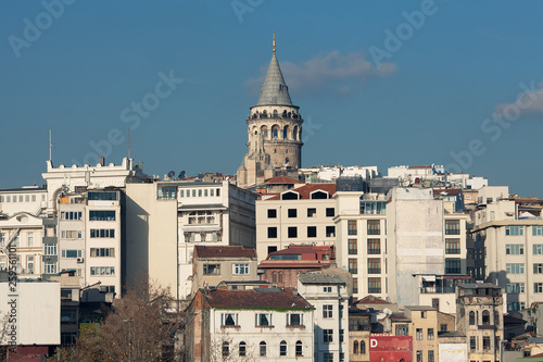 Galata Tower in Istanbul, Turkey. A view from water of Golden Horn bay. Sunny day. Text space. Outdoor shot