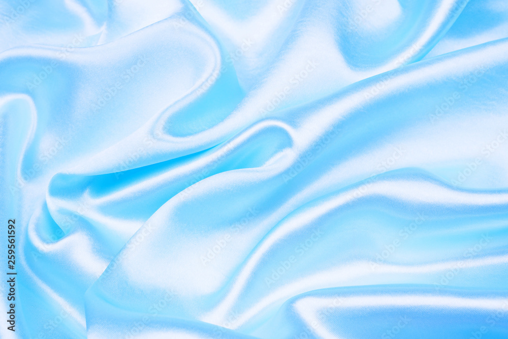 Smooth elegant blue silk or satin texture can use as abstract background
