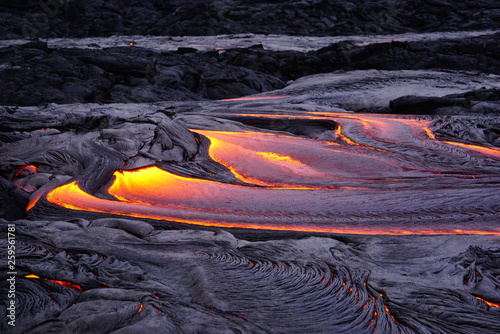 Lava field with new hot flowing lava in Big Island in Hawaii photo