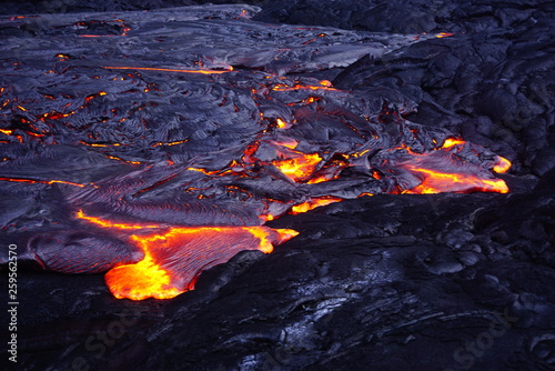 Lava field with new hot flowing lava in Big Island in Hawaii
