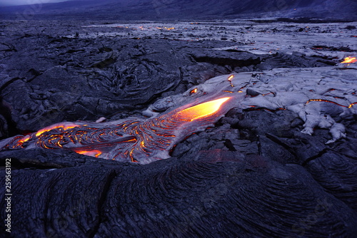 Lava field with new hot flowing lava in Big Island in Hawaii photo