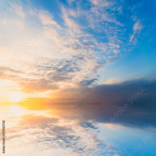 Background sky during sunset and water reflections.