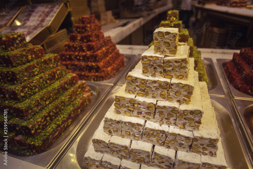 Turkish delight concept. Bunch of colorful rahat lokum in Istanbul dessert shop. Outdoor shot Turkish delight concept. Bunch of colorful rahat lokum in Istanbul dessert shop. Outdoor shot