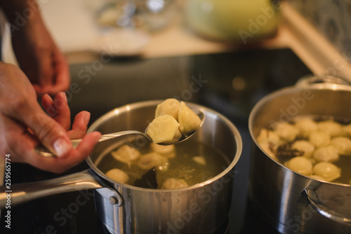 the preparation of dumplings with the help of pelmennitsa.