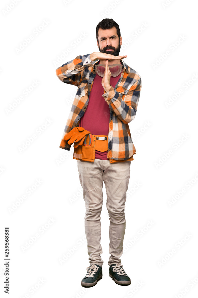Craftsmen man making time out gesture over isolated white background Craftsmen man making time out gesture over isolated white background