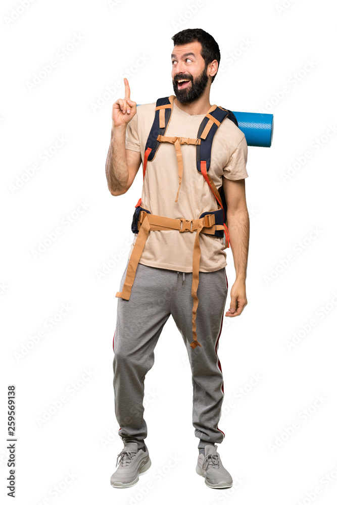 Hiker man intending to realizes the solution while lifting a finger up over isolated white background Hiker man intending to realizes the solution while lifting a finger up over isolated white background