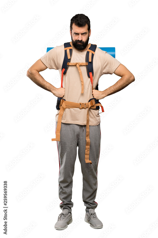 Hiker man angry over isolated white background Hiker man angry over isolated white background