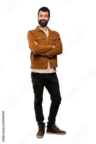 Handsome man with beard keeping the arms crossed in frontal position over isolated white background
