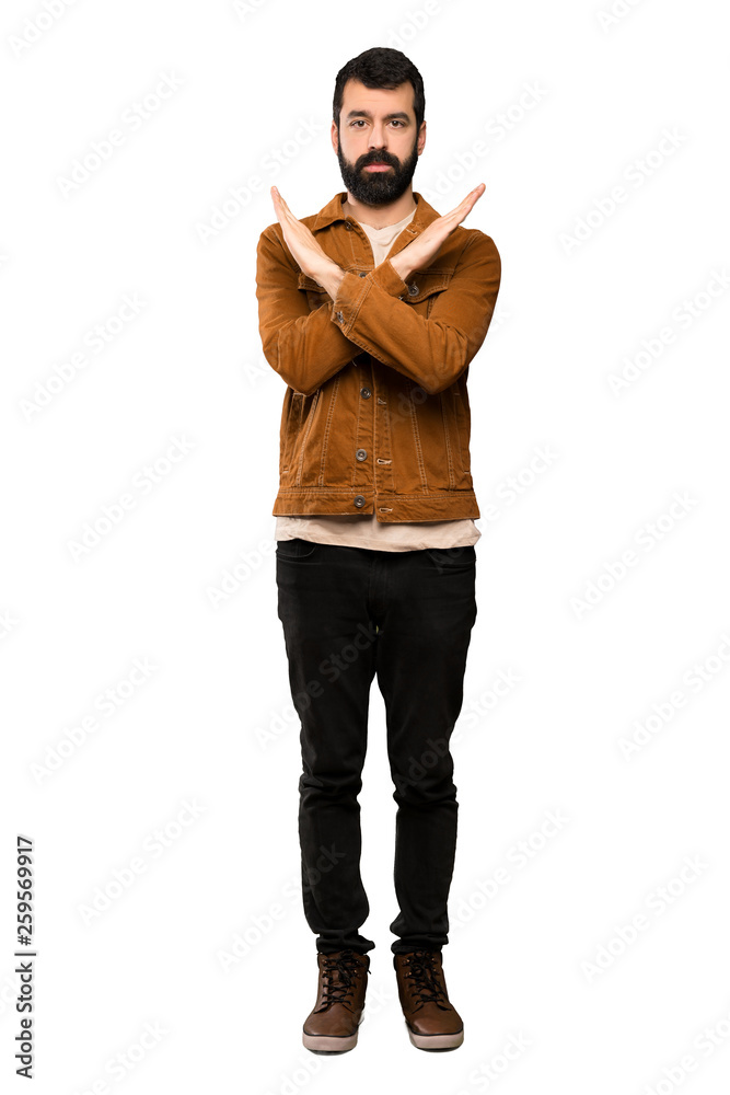 Handsome man with beard making NO gesture over isolated white background Handsome man with beard making NO gesture over isolated white background