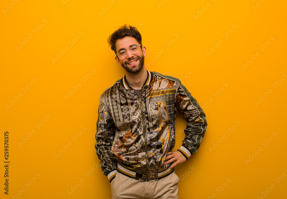 Young cool man with hands on hips Young cool man with hands on hips
