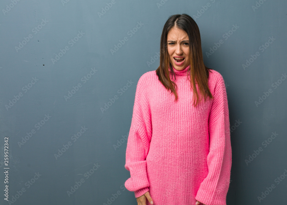 Obraz premium Young modern woman screaming very angry and aggressive