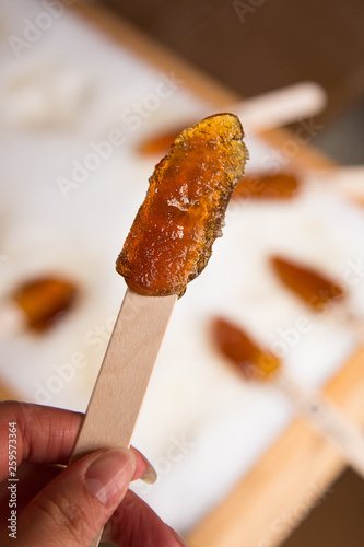 Making maple candy on snow in a maple sugar camp in New Brunswick