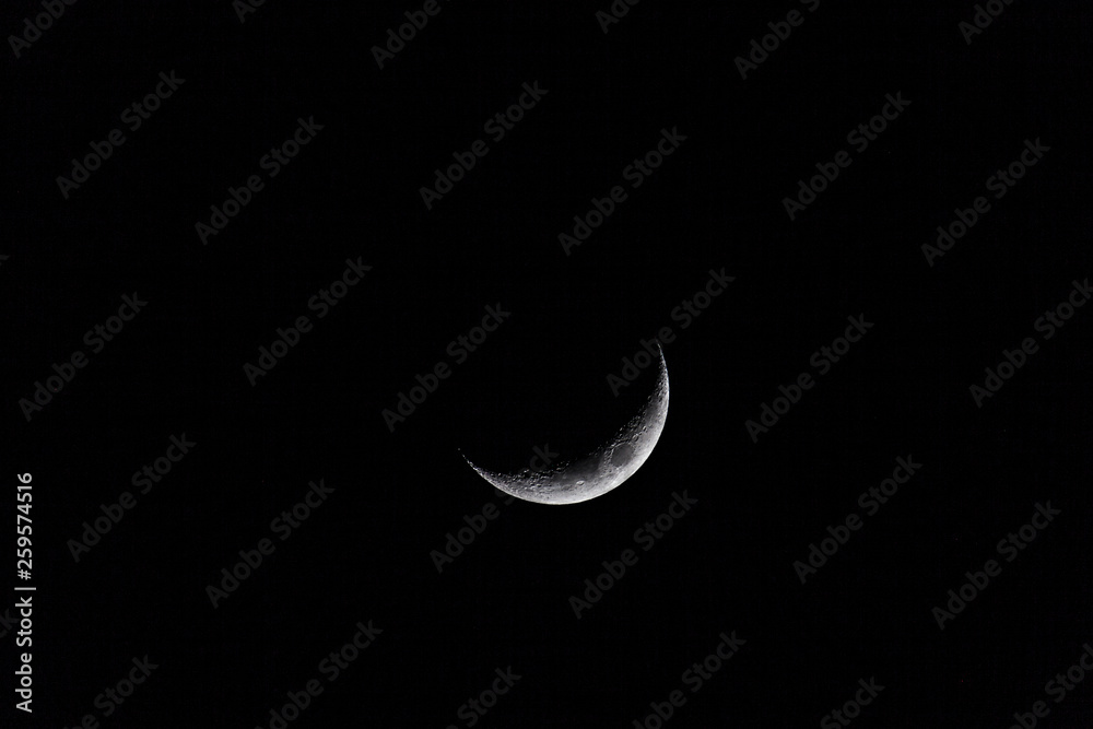 Crescent moon in a dark sky. Crescent moon in a dark sky.