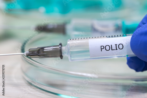 polio vaccination syringe background photo