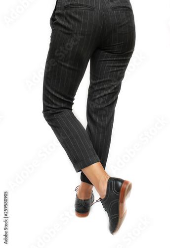 Women legs in leather boots fashion side view.