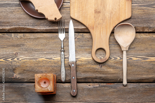 kitchen utensils on an old wooden table