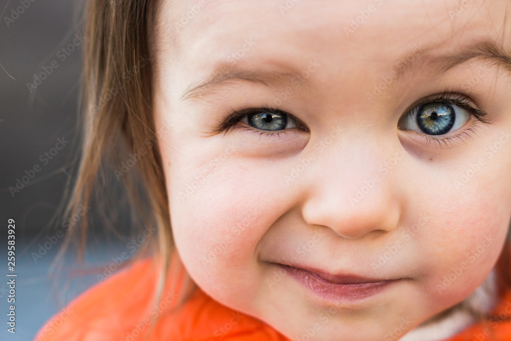 Funny Child Toddler Girl Winking Her Eye. Closeup Portrait, Beautiful Blue Baby Eyes Funny Child Toddler Girl Winking Her Eye. Closeup Portrait, Beautiful Blue Baby Eyes