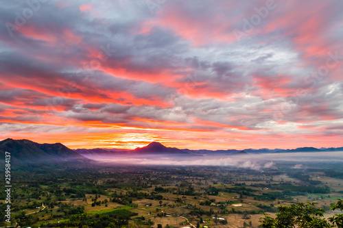 Sunrise at Phu Thok, view misty morning  around with mist and cloudy sky,  beautiful mountain. Khan District, Loei, Thailand © wanna