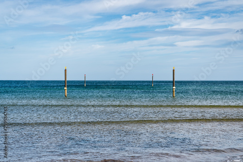 Piles in the North Sea, seen from North Beach in Cambois near Blyth, Northumberland, England, UK photo