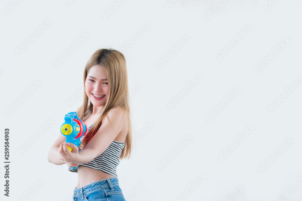 Asian sexy woman with gun water in hand on white background,Festival songkran day at thailand,The best of festival of thai,Land of smile Asian sexy woman with gun water in hand on white background,Festival songkran day at thailand,The best of festival of thai,Land of smile
